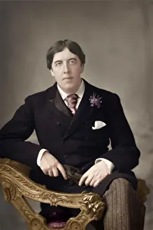 Sits Prints: Portrait of Oscar Wilde - Irish Playwright sitting in chair