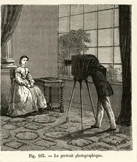 Portrait of a woman is captured in a photography studio