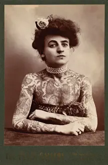 Body Prints: Portrait of a woman showing images tattooed or painted on he
