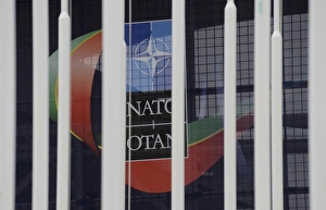 Nato Collection: PORTUGAL. Lisbon. A NATO sign is seen through