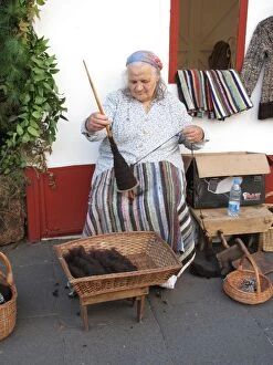 Images Dated 30th December 2015: Portugal, Madeira, Funchal: Peasant woman spinning wool