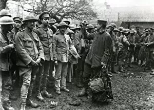 Images Dated 30th September 2011: Portuguese prisoners handing over gas masks, WW1