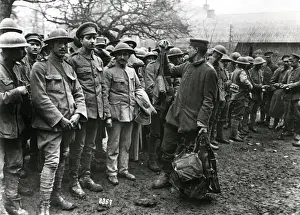 Handing Prints: Portuguese prisoners handing over gas masks, WW1