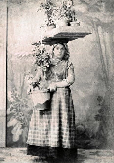 Backdrop Collection: Portuguese woman flower seller, Lisbon, Portugal