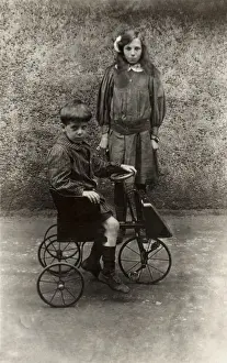 Pedal Prints: Posing with a toy pedal car