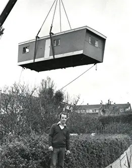 Deliver Prints: Prefabricated unit delivered to a garden by crane