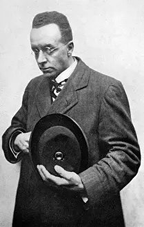 Press Prints: Press photographer with hidden camera in his hat