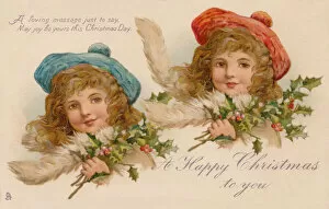 Images Dated 23rd November 2019: Pretty girls with holly