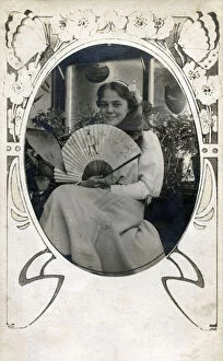 Smiles Gallery: Pretty young girl holding a Stowers promotional fan