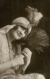 Shot Prints: Pretty young lady in a party frock with feather fan