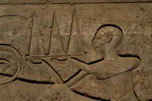 Ninettenth Prints: Priest wearing offerings in a tray. Relief. Luxor temple. Eg
