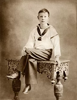 Jul17 Collection: Prince Albert George sitting on a table in relaxed pose