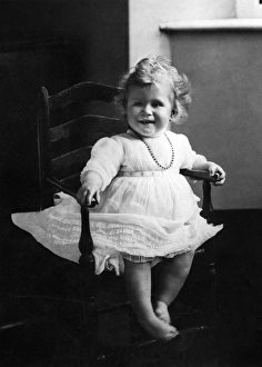 Images Dated 30th August 2011: Princess Elizabeth of York sits in a high chair