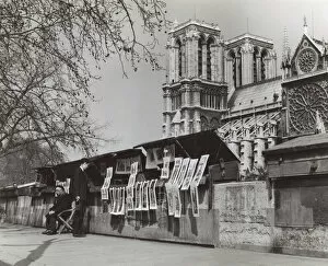 Print seller and customer near Notre Dame, Paris, France
