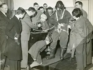 Lecture Prints: Professor G. T. R. Hill demonstrating a Sidcup flying suit?