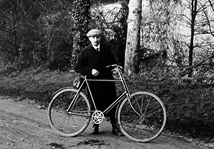 Proud cyclist with his bicycle, early 1900s