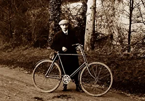 Proud cyclist with his bicycle, early 1900s