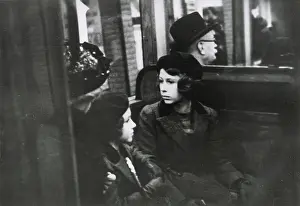 A much publicised first trip on the London Underground for Princesses Elizabeth (Queen Elizabeth II) and Margaret Rose, who made the trip on a District Line train from St. James's Park station with their governess on 15 May 1939. Date: 1939