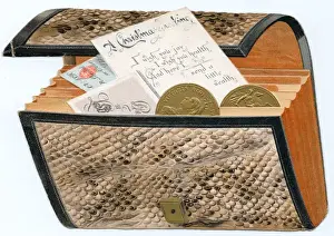 Purse full of money on a cutout Christmas card