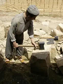 Quarryman splitting limestone block, Siggiewi, Malta