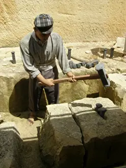 Quarryman splitting limestone block, Siggiewi, Malta