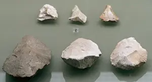 Quartzite cleaver and bifaces. Middle Paleolithic or Mouste