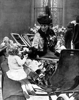 Images Dated 24th February 2005: Queen Alexandra receiving a rose from a child, London, 1925