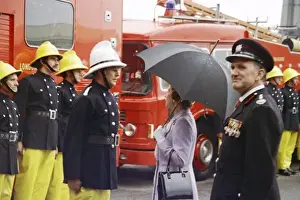 Queen Elizabeth II inspecting firefighters