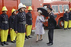 Images Dated 31st May 1977: Queen Elizabeth II inspecting firefighters