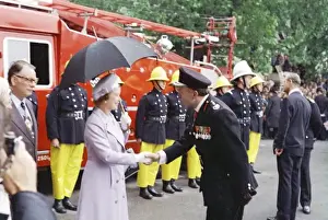 Queen Elizabeth II inspecting firefighters, London