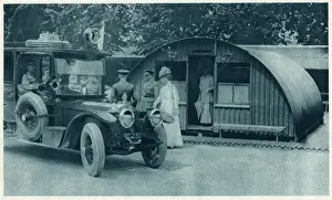 Inspects Prints: Queen Mary inspects a Nissen hut, 1917