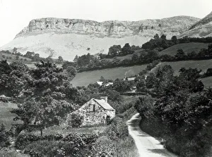 Looming Prints: Quiet Welsh country lane with steep rocky escarpment