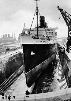Whilst Prints: R. M. S. Queen Mary in dry dock, Southampton, April 1936