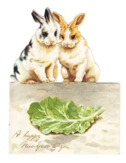 Lettuce Prints: Two rabbits with lettuce on a cutout New Year card