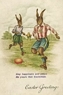 Rabbits playing football on an Easter postcard