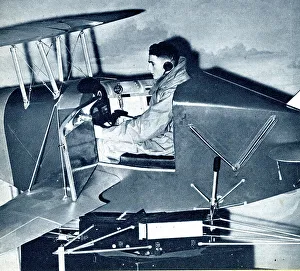 Cadet Prints: RAF cadet learning on a link trainer, WW2