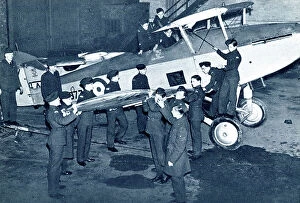 Cadet Collection: RAF cadets fitting a wing onto a fighter plane, WW2