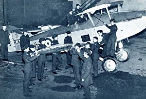 Cadets Prints: RAF cadets fitting a wing onto a fighter plane, WW2