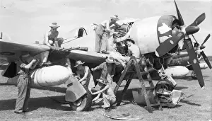 Batavia Prints: An RAF ground crew service a Republic P-47 Thunderbolt