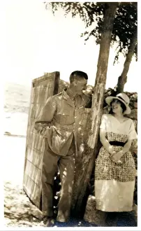 RAF officer and wife under shady tree, Middle East