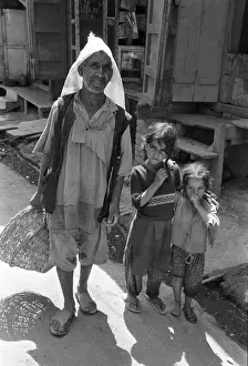 Jammu Prints: Ragged man and children, Kashmir