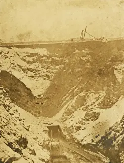 Railway scene, track leading to a hillside tunnel