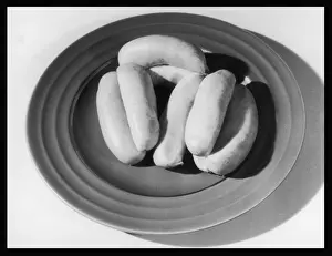 Meat Prints: Raw Sausages on a Plate