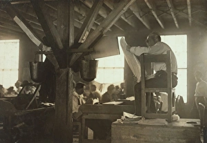 A Reader in cigar factory, Tampa, Fla. He reads books and ne A Reader in cigar factory, Tampa, Fla. He reads books and ne