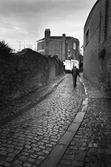 Cold Gallery: Rear view of man walking Belmont Bank, Shrewsbury