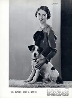 The reason for a dance. Lady Gloria Vaughan (pictured with her terrier) debutante daughter of the Earl and Countess of Lisburne, was the charming reason for the dance which Lady Lisburne gave at 5, Upper Berkeley Street. Date: 1934