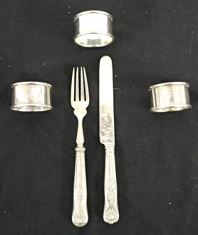 Rings Collection: Red Star Line - three metal napkin rings, knife and fork
