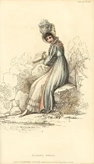 Regency woman in walking dress reading a book in a park, 1815