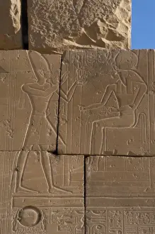 Relief depicting a Pharaoh making offerings to the god Ra. R