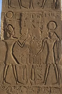Theban Collection: Relief depicting a Pharaoh making offerings to the god Ra. R